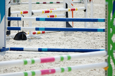 Show jumping poles obstacles, barriers, waiting for riders on show jumping training. Horse obstacle...