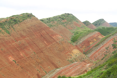 Colorful spectacular panoramic view of rainbow mountains hills in Georgia. Striped desert of Mravaltskaro mountains at the border of Georgia and Azerbaijan. Famous tourist place at Gareja, Kakhetiの写真素材