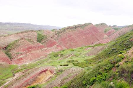 Colorful spectacular panoramic view of rainbow mountains hills in Georgia. Striped desert of...