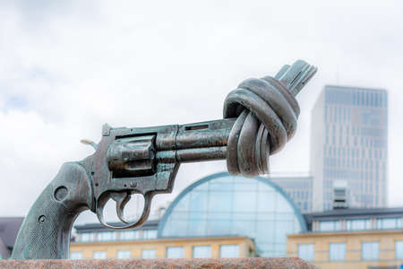 MalmÃ¶, Sweden - May 17, 2020: Carl Fredrick ReuterswÃ¤rd's sculpture Non violence also on...