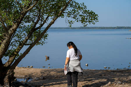 Beautiful scenery at a lake one of the latest days of summer. Picture from Ringsjon, Scania, southern Sweden. Blue sky meets blue waterの写真素材