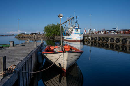 June 26, 2021 - Boda Harbour: A small fishing boat in beautiful sunset light. These fine days have brought a significant rise in tourism activities on the island of Olandのeditorial素材