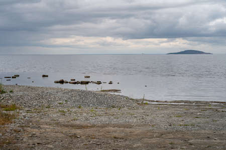 A beautiful seashore with a dramatic sky in the background. Picture from the Baltic Seaの写真素材