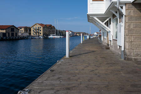 September 10, 2021 - Smogen, Sweden: The long boardwalk in the town center attracts tourists to this west coast archipelago regionのeditorial素材