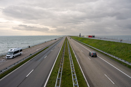 The Afsluitdijk is a major dam and causeway in the Netherlands. It is a fundamental part of the larger Zuiderzee Works, damming off salt water of the North Sea, and turning it into a freshwater lakeの写真素材