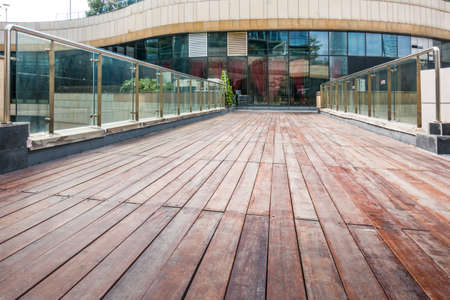 empty brick road nearby office building,china