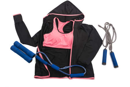 Flat lay of red dumbbell, sport bra, jump rope and sneaker, sport equipments, fitness items, top viewの写真素材