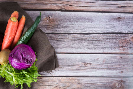 Mixed vegetables on wooden background, top view.の写真素材