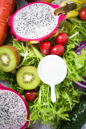 fresh healthy vegetables and friuts on a blue pastel backgroundの写真素材