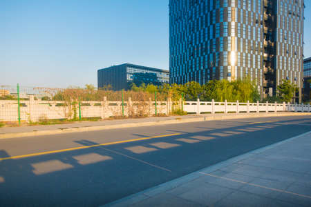 empty brick floor with modern building in background