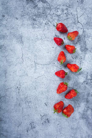 Flat lay composition with chocolate covered strawberries on grey backgroundの写真素材