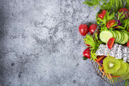 Various green leafy vegetables in row on white background. Top view point.の写真素材