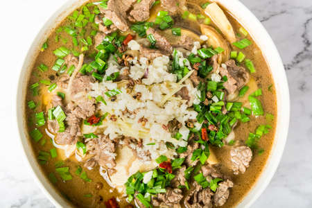 A bowl of spicy water-boiled meat slices