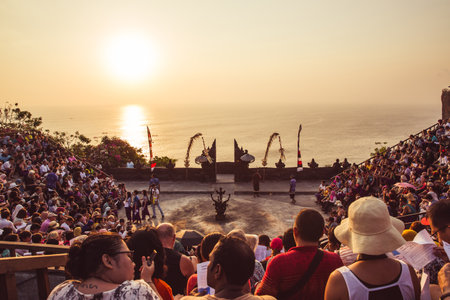 Bali - Indonesia - 10.21.2015: Tourists waiting for the Kecak Fire Dance in the Uluwatu Temple amphitheater at sunsetのeditorial素材