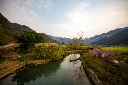 Landscape scenery view of a river and mountains in spring, China.
