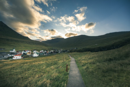 Sunset over a small village in the Faroe Islands, Denmarkの写真素材