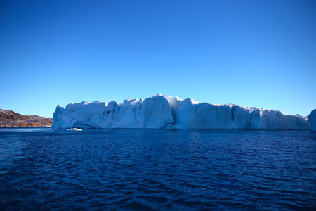 Antarctic landscape with icebergs and blue sky, Antarctic Peninsula