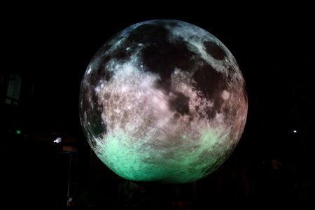 A full moon in the night sky. A full moon in the night sky.