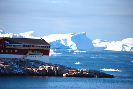 Antarctic landscape with icebergs and cruise ship in the ocean