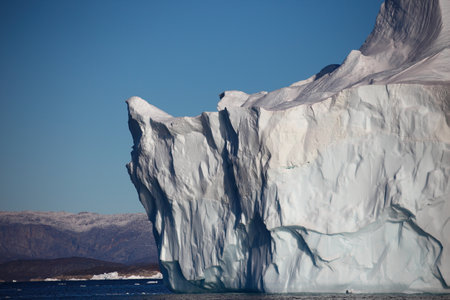 Antarctic iceberg in the snow, Antarctic Peninsula, Antarctica.
