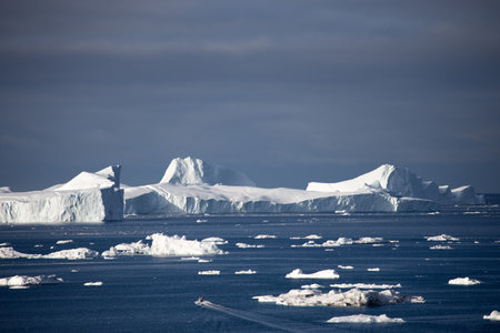 Antarctic landscape with icebergs, ice floes and glaciers