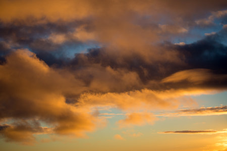 Cloudscape, Colored Clouds at Sunset near the Ocean as a Background
