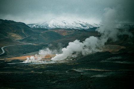 Icelandic landscape with snow capped mountains and fumaroles. Toned.
