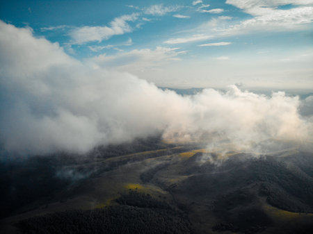 Aerial view of foggy valley in the Carpathian mountainsの写真素材