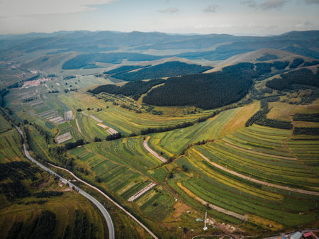 Aerial view of countryside and road in rural area of Georgia.