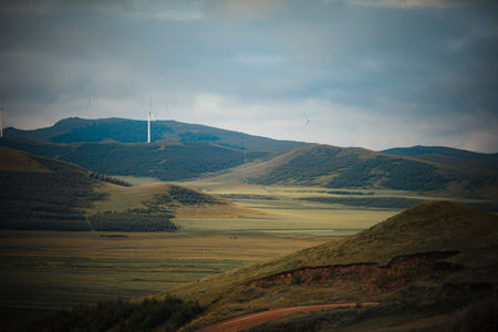 Mountain landscape with wind turbines in the evening. Altai, Russiaの写真素材