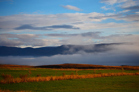 Rural landscape with a cloudy sky, Scotland, United Kingdom.の写真素材