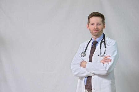 Serious Physician with crossed armsの写真素材
