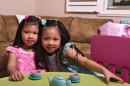 Asian toddlers playing and huggingの写真素材