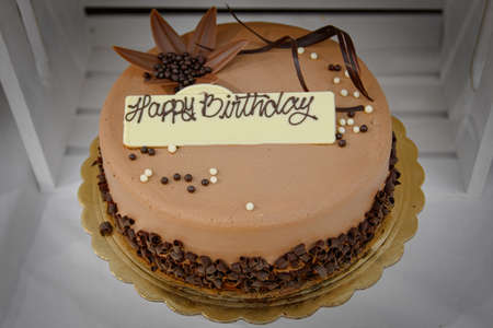 Chocolate birthday cake with Happy Birthday Signの写真素材