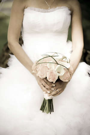 Bride holding a wedding bouquetの写真素材