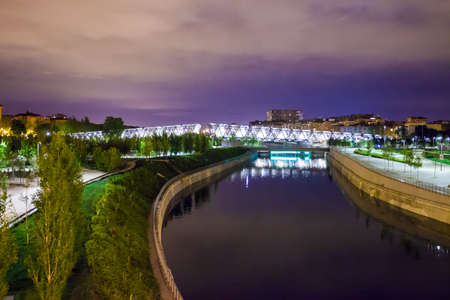 Madrid, Spain - May 8, 2012: Arganzuela Bridge illuminated on a spring night and Madrid Rio Park, Madrid, Spainのeditorial素材