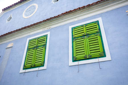 Viscri Romania  June 23 2013: Blue painted traditional house with green shutters from Viscri village in Transylvania Romaniaのeditorial素材