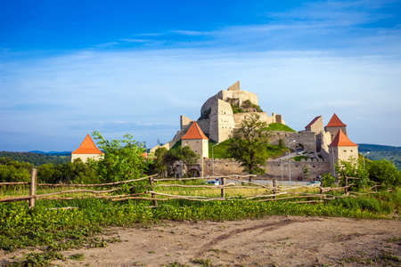 Rupea, Romania - June 23, 2013: Tourists visiting the old medieval fortress on top of the hill, Rupea village located in Transylvania, Romaniaのeditorial素材