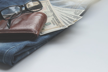 Jeans, wallets, dollar, glasses for the financial and tourism background.