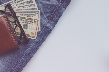 Jeans, wallets, dollar, glasses for the financial and tourism background.の写真素材