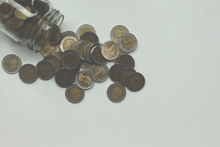 Saving the Coins of thailand on a white background.