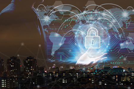 Businessman hand holding network using Currencies sign symbol interface of padlock over the Network...