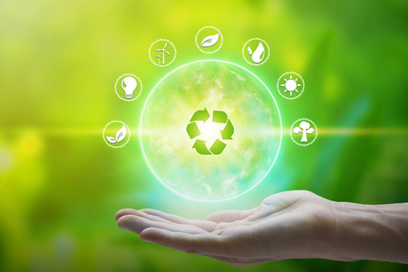 Hand holding with environment Icons over the Network connection on nature background, Technology...