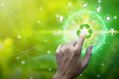 Finger touch with environment Icons over the Network connection on nature background, Technology ecology concept.の写真素材