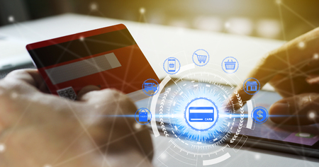 Hand holding credit card and using tablet with online shopping icons technology, Online shopping conceptの写真素材