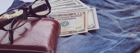 Jeans, wallets, dollar, glasses for the financial and tourism background.