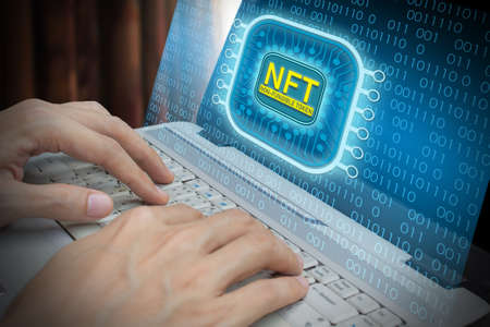 Business man using laptop computer invest and pay for unique collectibles in games or art, NFT non...