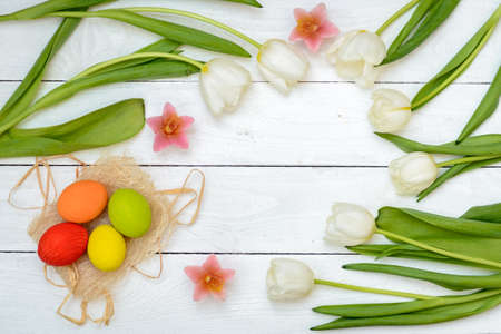 Easter Eggs and Tulips on Old White  Wood - Season Background Frameの写真素材