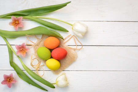 Easter Eggs and Tulips on Old White  Wood - Season Background Frameの写真素材