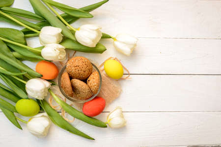 Easter Eggs and Tulips on Old White  Wood - Season Background Frameの写真素材